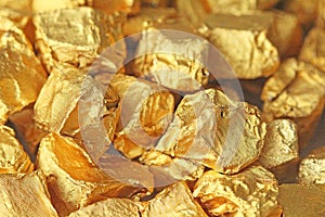 Golden Background. Ingots or Nuggets of Pure Gold. Gold leaf. Te