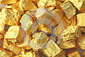 Golden Background. Ingots or Nuggets of Pure Gold. Gold leaf. Te