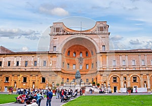 Golden Ball sculpture and Belvedere palace in courtyard of Vatican Museum