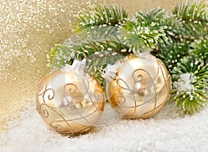 Golden balls with christmas tree branch