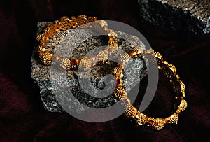 Golden Bangles On rock