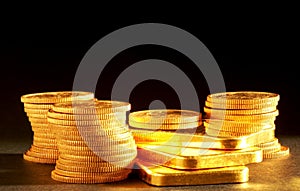 Golden bars and coins photo