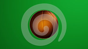 Golden basketball ball rotates on green screen background.