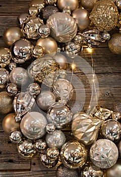 Golden baubles threaded to make a wreath