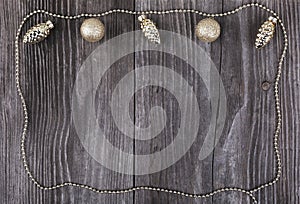 Golden baubles on wooden background