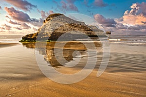 Golden beach and unusual rock in harente Maritime France