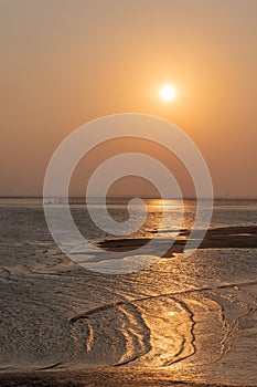 Golden beaches and fishing boats on the beach at dusk