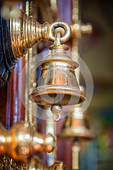 Golden bell, detail of the door of Sri Veeramakaliamman Temple in Singapore