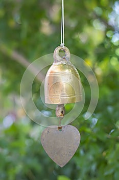 Golden bell with green bokah background