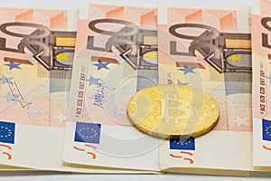 Golden Bitcoin on 50 Euro. Electronic money exchange concept