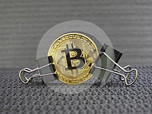 Golden Bitcoin clamped