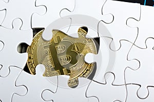 Golden bitcoin coin. cryptocurrency. Missing jigsaw puzzle pieces. Business concept. Compliting final task