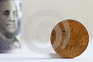 Golden Bitcoin and banknotes