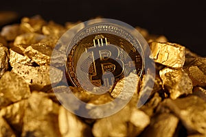 Golden Bitcoin Coin and mound of gold. Bitcoin cryptocurrency. Business concept