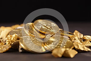 Golden Bitcoin Coin and mound of gold. Bitcoin cryptocurrency. Business concept