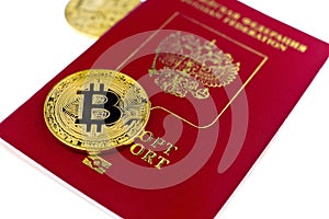 Golden bitcoin coin and passport of Russian Federation