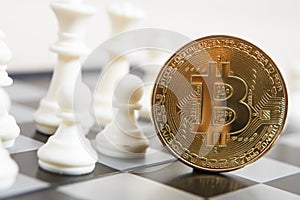 Golden bitcoin coin symbolizes elements with chess board