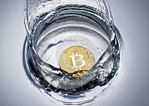 golden bitcoin coin with water splash crypto currency background