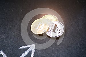 Golden bitcoin coins on a dark background with reflection. Virtual currency. Crypto currency. New virtual money. Lens flare