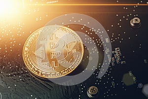 Golden Bitcoin at computer chip background with light effect