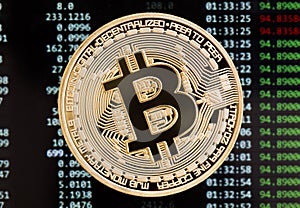 Golden bitcoin cryptocurrency coin on a circuit board background