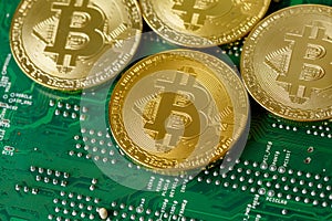 Golden Bitcoin Cryptocurrency On Computer Circuit Board CPU