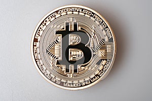Golden bitcoin cryptocurrency on white background