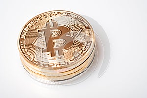 Golden bitcoin cryptocurrency on white background