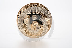 Golden bitcoin cryptocurrency on white background