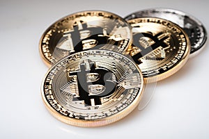 Golden bitcoin cryptocurrency on white background