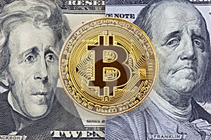 Golden bitcoin on dollar bills background.
