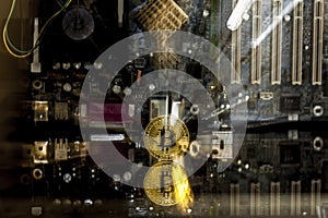 Golden bitcoin in front of a motherboard