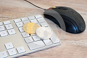 Golden bitcoin on a keyboard