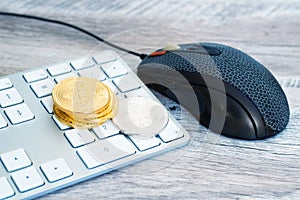 Golden bitcoin on a keyboard