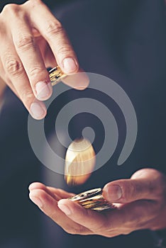 Golden Bitcoin in a man hand, Digitall symbol of a new virtual c