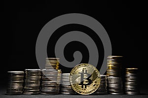 Golden bitcoin with money coins background. Bitcoin on black background