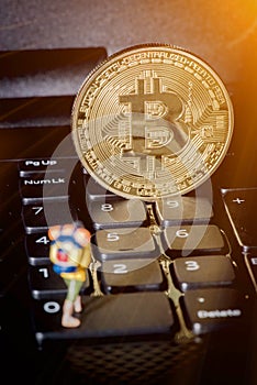 Golden Bitcoin money on computer.
