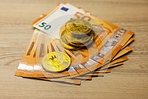 Golden bitcoin over Euro money. Crypto currency concept
