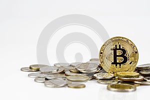 Golden bitcoin over many international money coins isolated on white background.  Crypto currency concept.  Bitcoin cryptocurrency