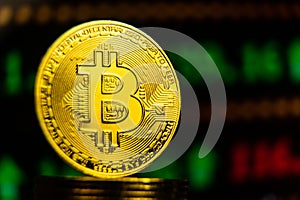 Golden bitcoin with rising green stock trading chart