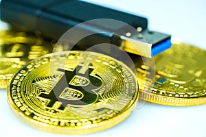 Golden bitcoin and USB flash drive