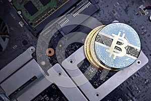 Golden bitcoins with flag of botswana on a computer electronic circuit board. bitcoin mining concept