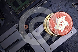 Golden bitcoins with flag of hong kong on a computer electronic circuit board. bitcoin mining concept