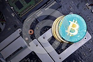 Golden bitcoins with flag of kazakhstan on a computer electronic circuit board. bitcoin mining concept
