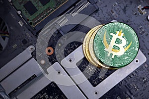 Golden bitcoins with flag of mauritania on a computer electronic circuit board. bitcoin mining concept