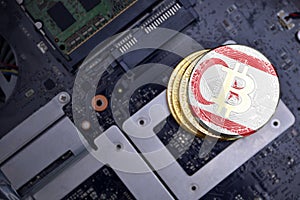 Golden bitcoins with flag of northern cyprus on a computer electronic circuit board. bitcoin mining concept