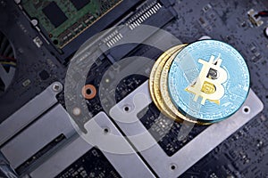 Golden bitcoins with flag of saint lucia on a computer electronic circuit board. bitcoin mining concept