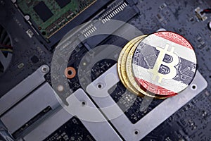 Golden bitcoins with flag of thailand on a computer electronic circuit board. bitcoin mining concept