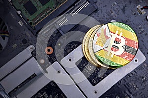 Golden bitcoins with flag of zimbabwe on a computer electronic circuit board. bitcoin mining concept