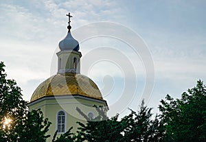 Golden and blue domes with crosses of a blue sky